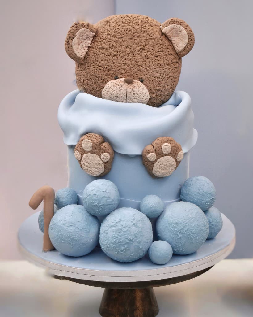Blue teddy bear first birthday cake