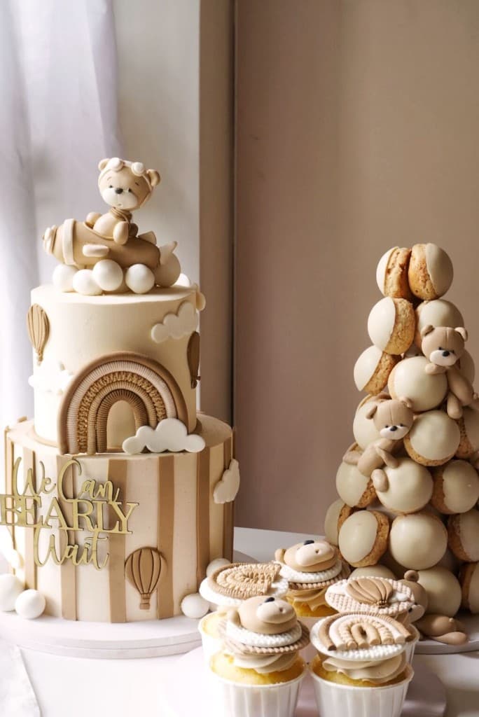 Neutral teddy themed dessert table cake