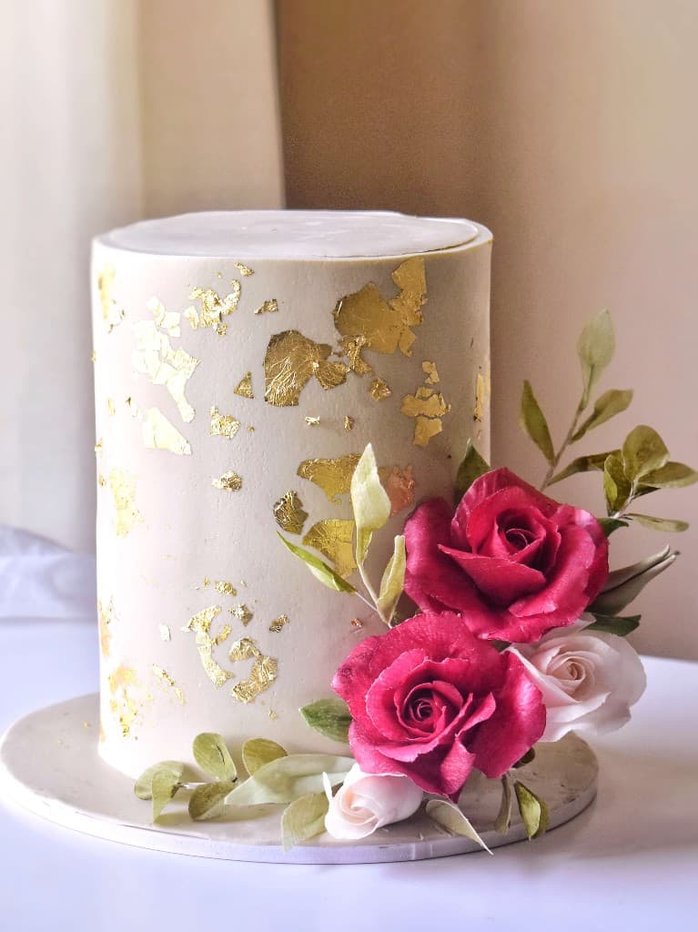 Wedding cake with gold leaf and rose details